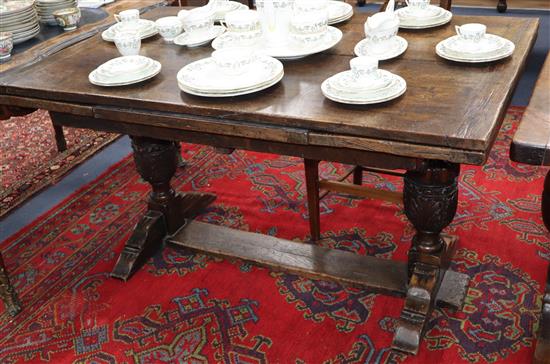 A 17th century style oak draw leaf dining table 210cm extended